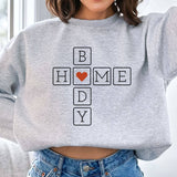 "Home Body Introvert Heart" design on an ash gray unisex crewneck sweatshirt