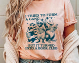 "I Tried To Form A Gang Book Club" design on a peach unisex t-shirt