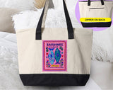 "Sardines Purple Stamp" design on a natural canvas zippered tote bag