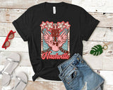 "Nashville Pink Wing" design on a black unisex t-shirt