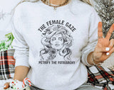 "The Female Gaze" design on an ash gray unisex crewneck sweatshirt