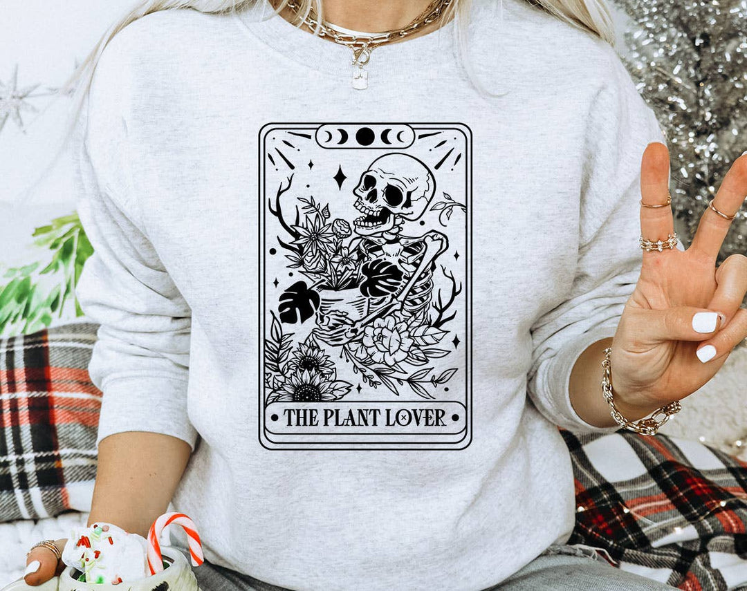 "The Plant Lover Tarot B&W" design on an ash gray unisex crewneck sweatshirt