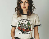 "I Know Your Lane Sucks Skeleton" design on a natural ringer t-shirt with black contrast trim