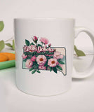 "North Dakota State Flower Wild Prairie Rose" design on a white ceramic coffee mug