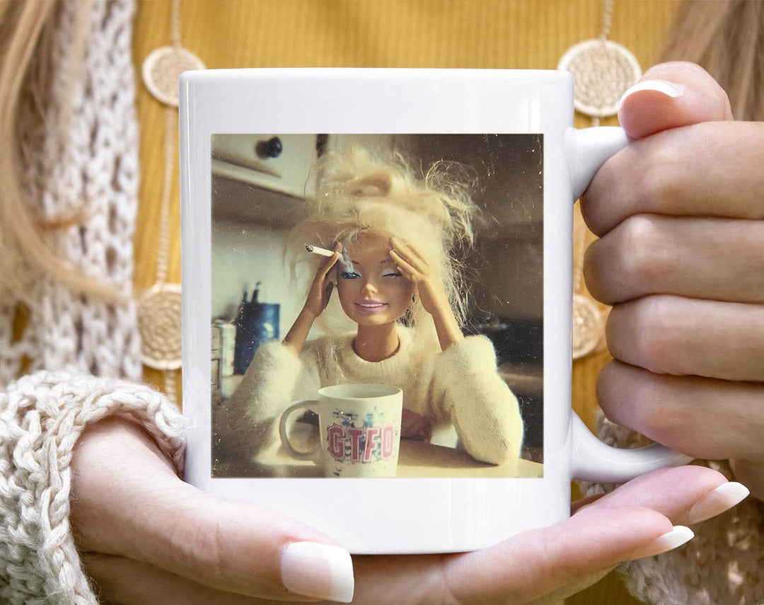 "Doll Face Meme Drinking Coffee Hot Mess" design on a white ceramic coffee mug