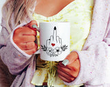 "Middle Finger Wreath Heart" design on a white ceramic coffee mug