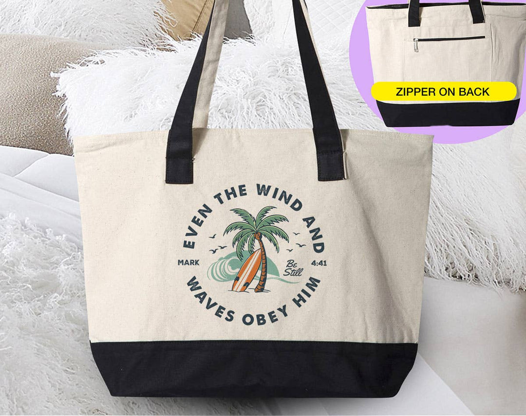 "Even The Wind & Waves Obey Him God Jesus Beach" design on a natural canvas zippered tote bag