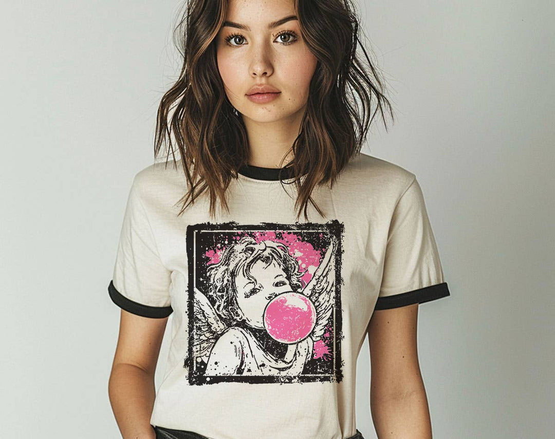 "Cupid Bubblegum Stamp" design on a natural ringer t-shirt with black contrast trim