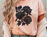 "Retro Linocut Black Peonies" design on a peach unisex t-shirt