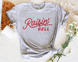 "Raisin' Hell" design on a heather gray unisex t-shirt