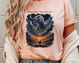 "Remember Who You Are T-Rex Chicken" design on a peach unisex t-shirt
