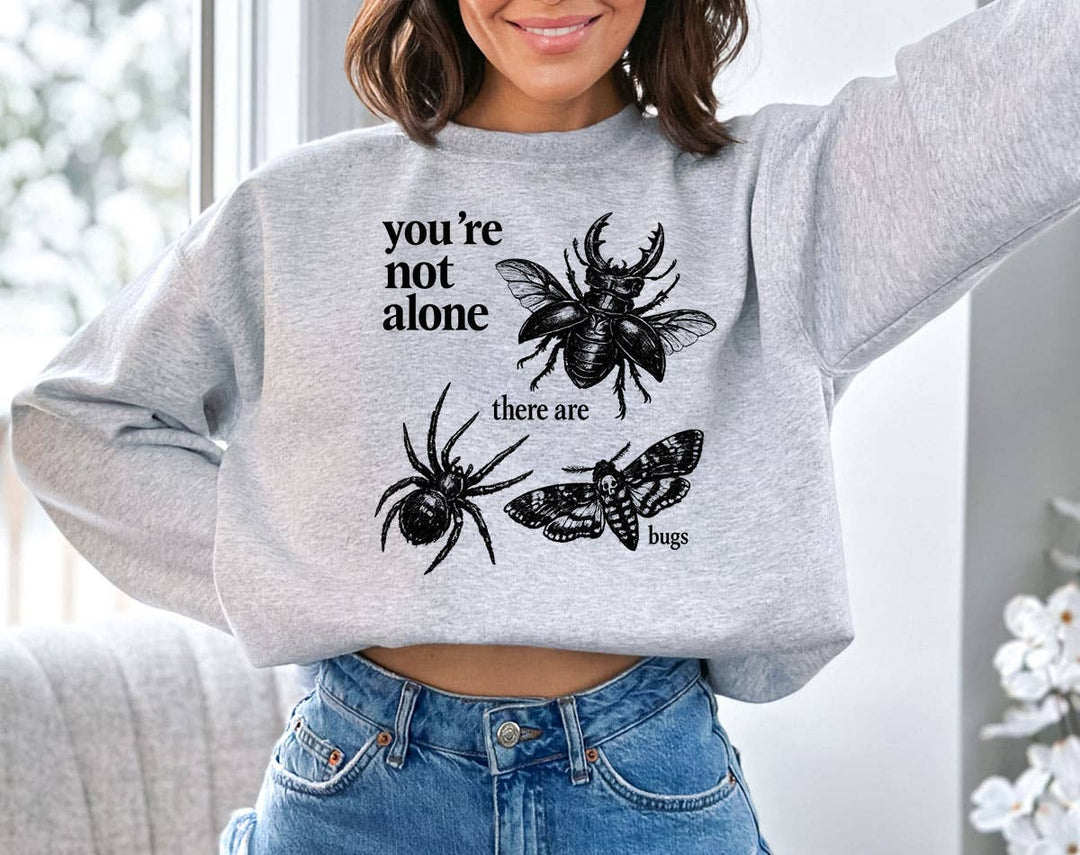 "You're Not Alone, There Are Bugs" design on an ash gray unisex crewneck sweatshirt