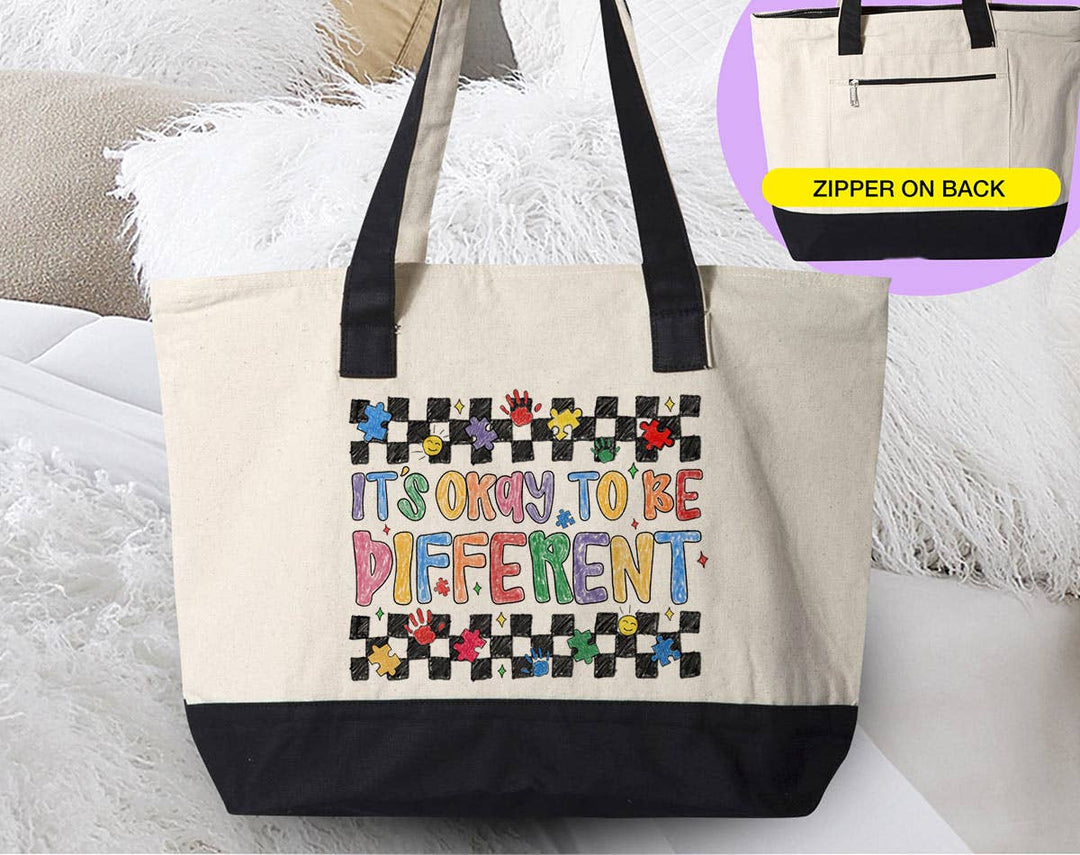 "It's Okay To be Different" design on a natural canvas zippered tote bag