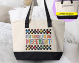 "It's Okay To be Different" design on a natural canvas zippered tote bag