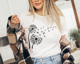 "Dandelion In The Wind" design on a white unisex t-shirt