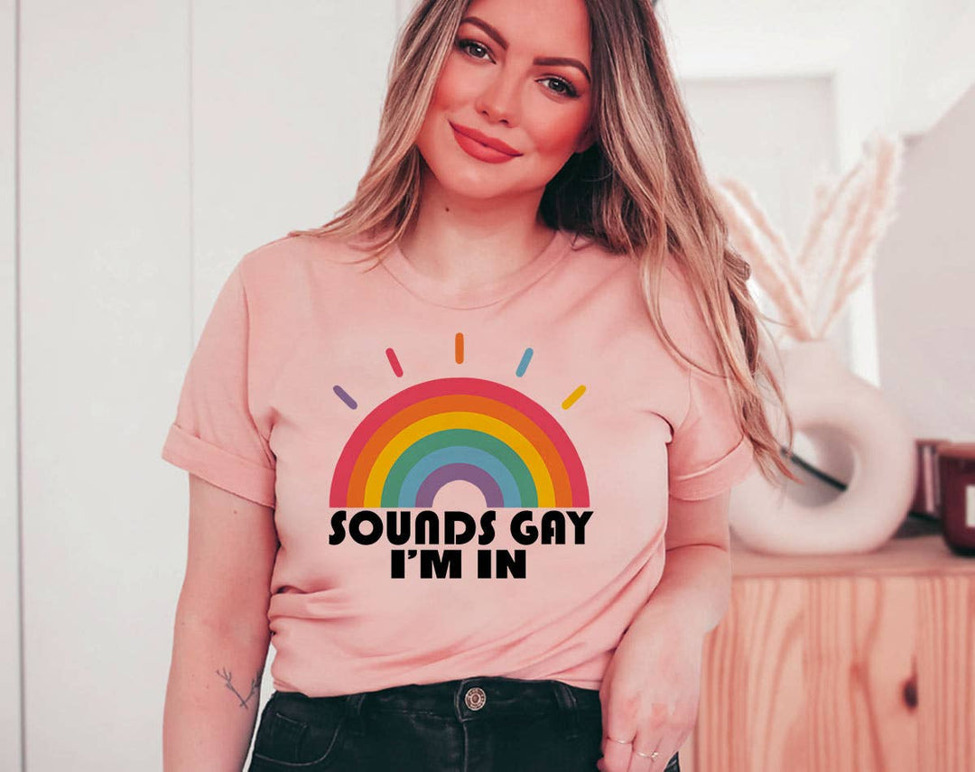 "Sounds Gay, I'm In" design on a peach unisex t-shirt