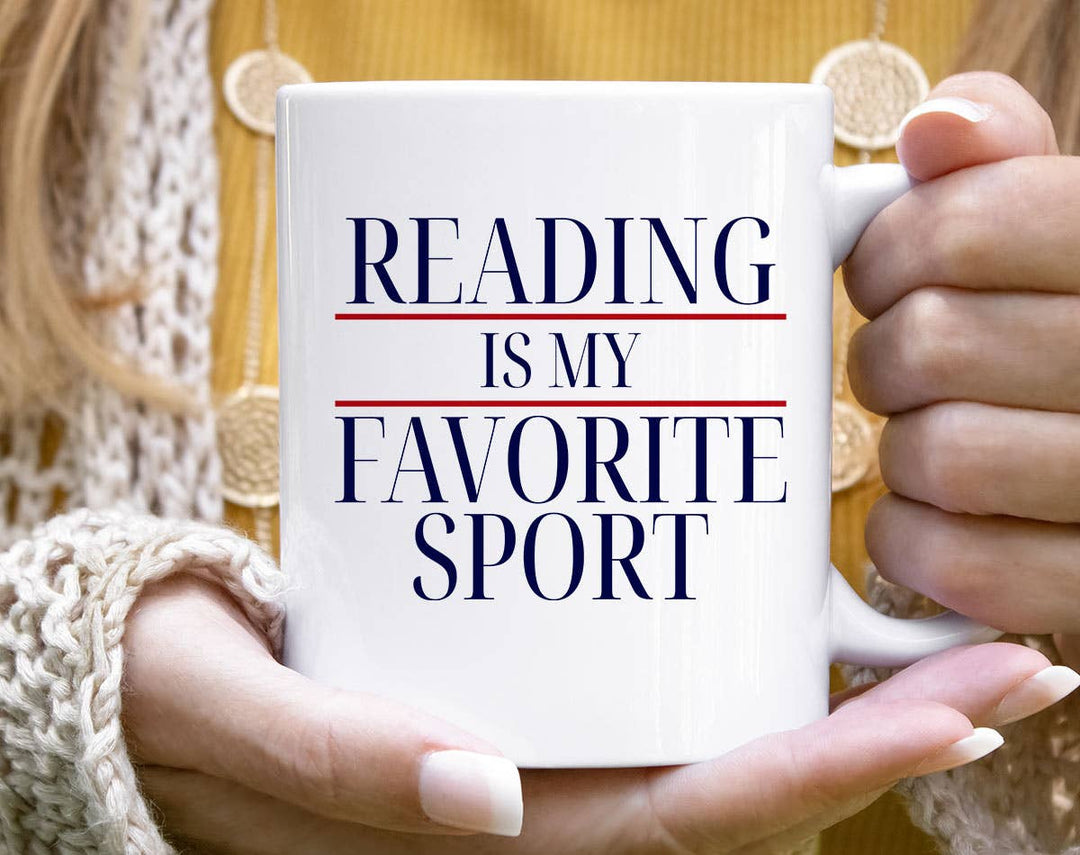 "Reading Is My Favorite Sport" design on a white ceramic coffee mug