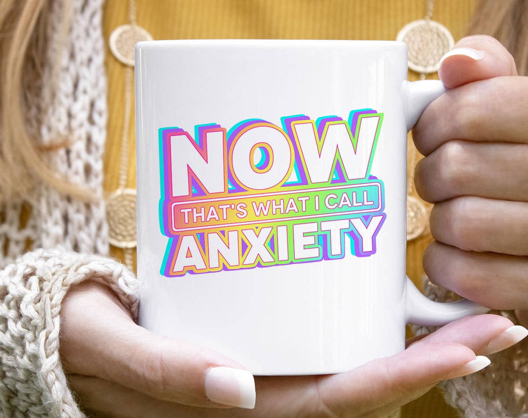 "Now That's What I Call Anxiety" design on a white ceramic coffee mug