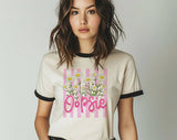 "Oopsie Daisy Flowers Striped" design on a natural ringer t-shirt with black contrast trim