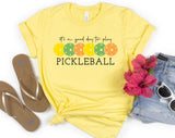 "It's Always A Good Day To Play Pickleball" design on a pale yellow unisex t-shirt