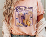 "Blue Moon Over Brooklyn Heated Rivalry" design on a peach unisex t-shirt