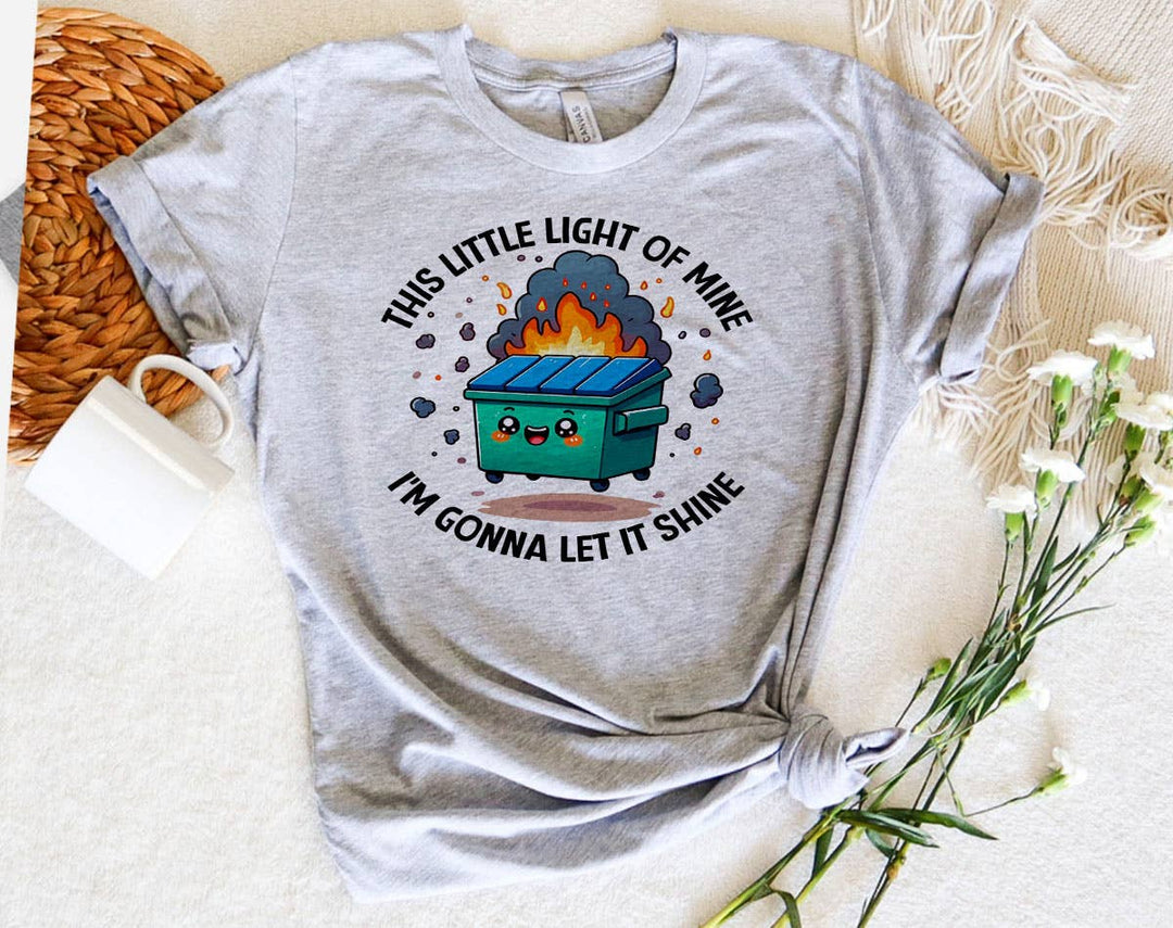 "This Little Light Of Mine Dumpster Fire" design on a heather gray unisex t-shirt