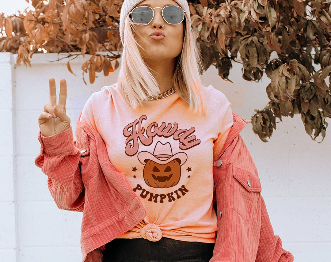"Howdy Pumpkin" design on a peach unisex t-shirt