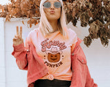 "Howdy Pumpkin" design on a peach unisex t-shirt