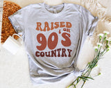 "Raised On 90s Country" design on a heather gray unisex t-shirt