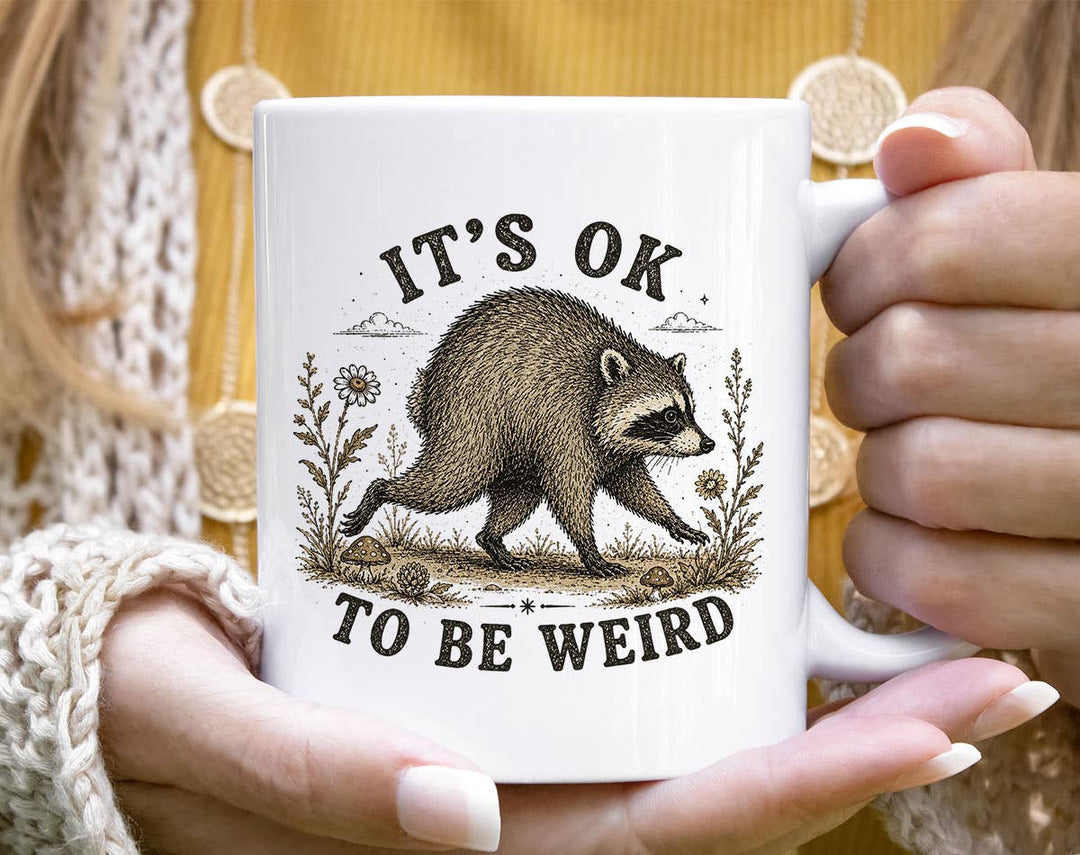 "It's Okay To Be Weird Jimothy" design on a white ceramic coffee mug