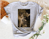 "Cat Getting Tattoo Meme" design on a heather gray unisex t-shirt