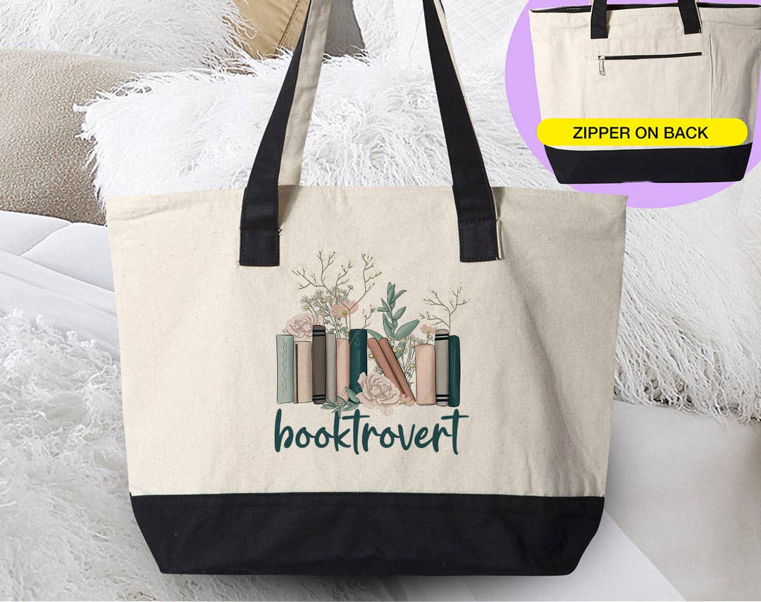 "Booktrovert" design on a natural canvas zippered tote bag