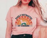 "Easily Distracted By Wieners" design on a peach unisex t-shirt