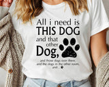 "All I Need Is This Dog And That Dog" design on a white unisex t-shirt