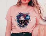 "Floral Blue Skull" design on a peach unisex t-shirt