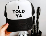 "I Told You" design on a mesh-back snapback trucker hat