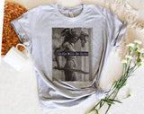 "Girls Will Be Girls Medusa" design on a heather gray unisex t-shirt