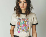 "Happy To See Your Face Teacher" design on a natural ringer t-shirt with black contrast trim