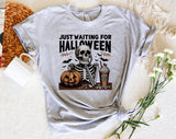 "Just Waiting For Halloween Skeleton" design on a heather gray unisex t-shirt