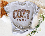 "Cozy Season Fall Leaves" design on a heather gray unisex t-shirt