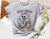 "Stay Weird Raccoon" design on a heather gray unisex t-shirt