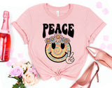 "Peace Summer Flower Smiley" design on a peach unisex t-shirt
