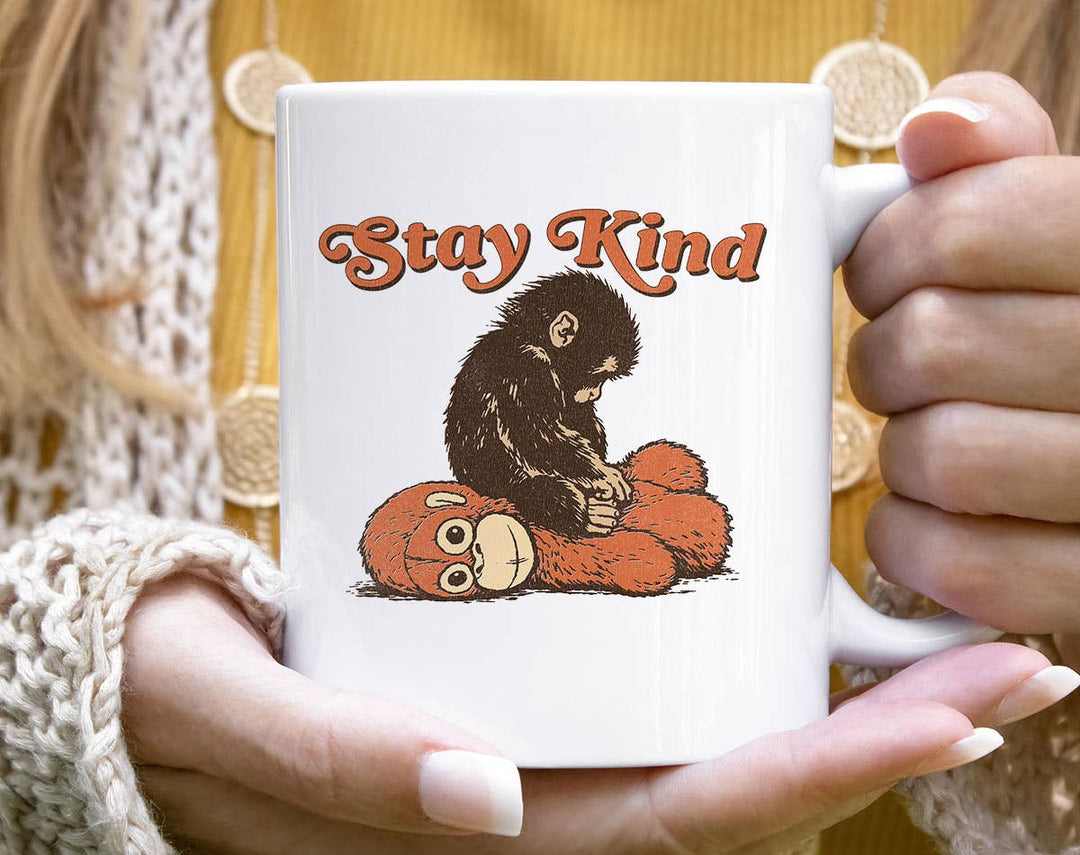 "Stay Kind Baby Punch Monkey" design on a white ceramic coffee mug