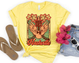 "Nashville Pink Wing" design on a pale yellow unisex t-shirt