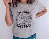 "Hoeing Ain't Easy" design on a heather gray unisex t-shirt