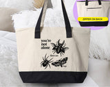 "You're Not Alone, There Are Bugs" design on a natural canvas zippered tote bag