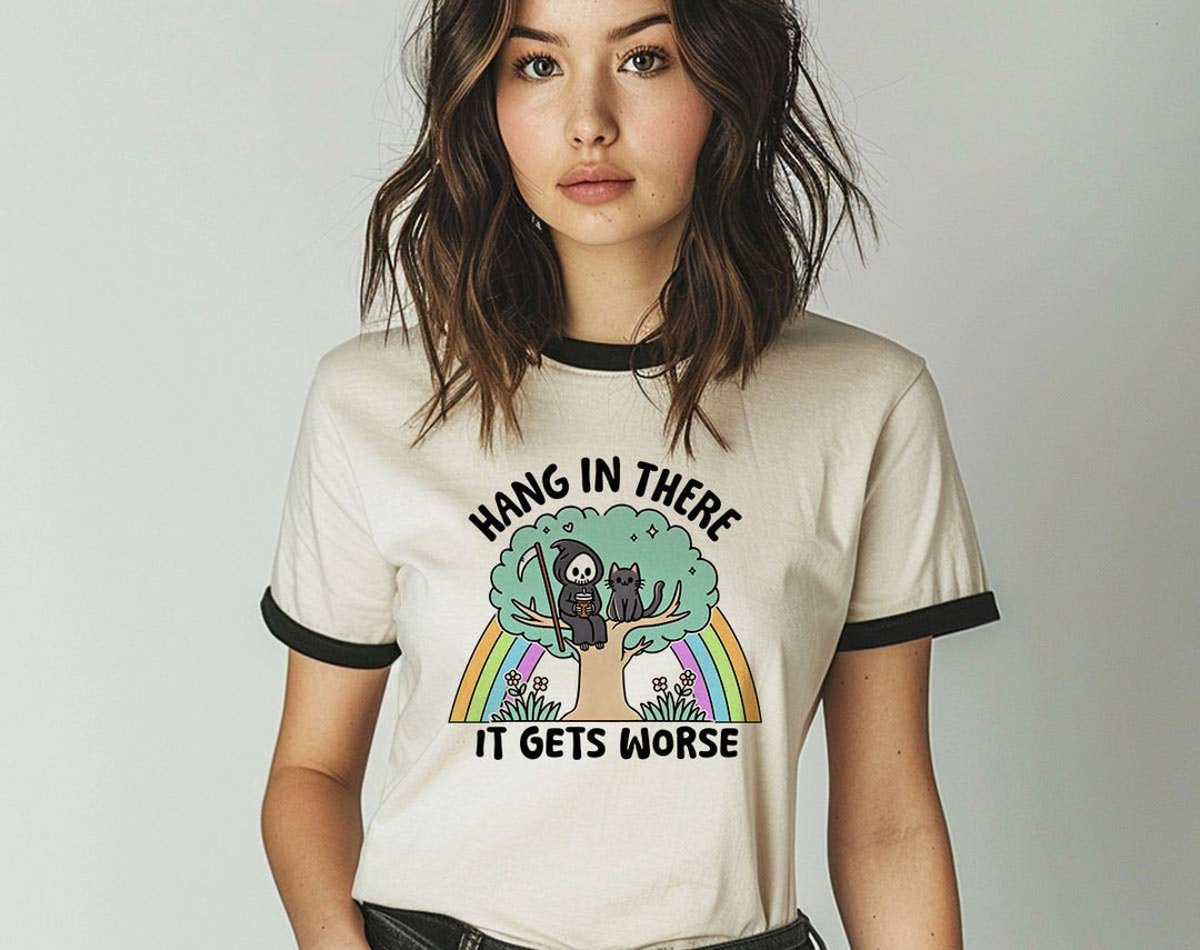"Hang In There It Gets Worse Cat" design on a natural ringer t-shirt with black contrast trim