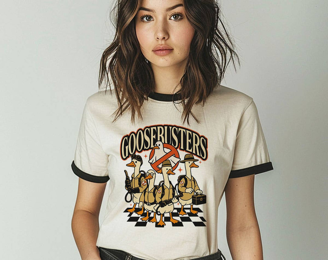 "Goosebusters Goose Ghost" design on a natural ringer t-shirt with black contrast trim