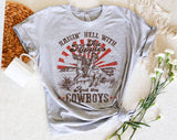"Raisin' Hell With The Hippies & Cowboys" design on a heather gray unisex t-shirt