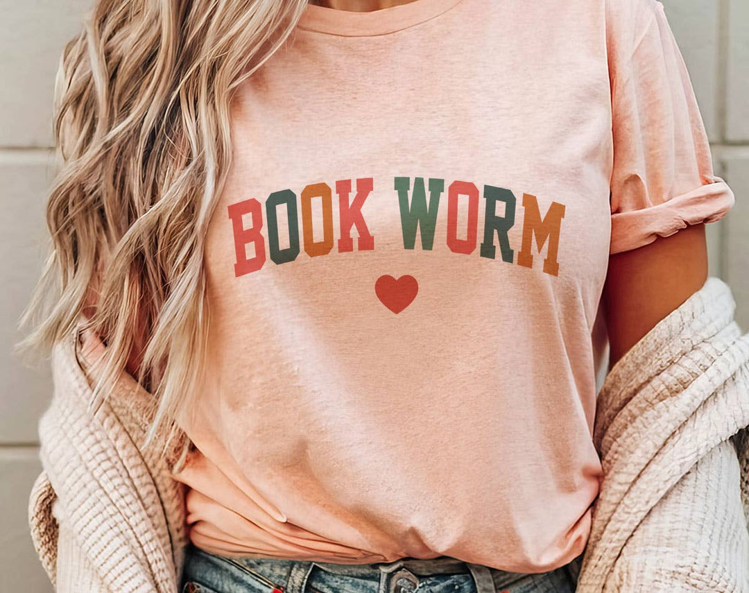 "Bookworm Heart" design on a peach unisex t-shirt